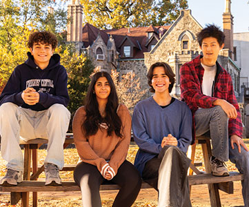 A group of students smiling. Links to Gifts of Appreciated Securities