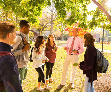 Class learning outside. Links to Gifts That Pay You Income