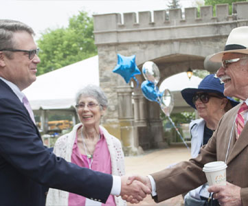 Two men shaking hands. Link to Life Stage Gift Planner Over Age 70 Situations.