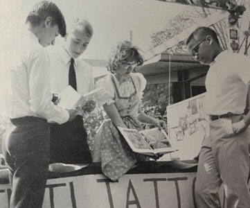 At Carnival 1966, John Schalow, left, and Juan Jewell, right, compare experiences with Gerd Dash and Heidi Aly from Graefelfing, Bavaria, W. Germany.